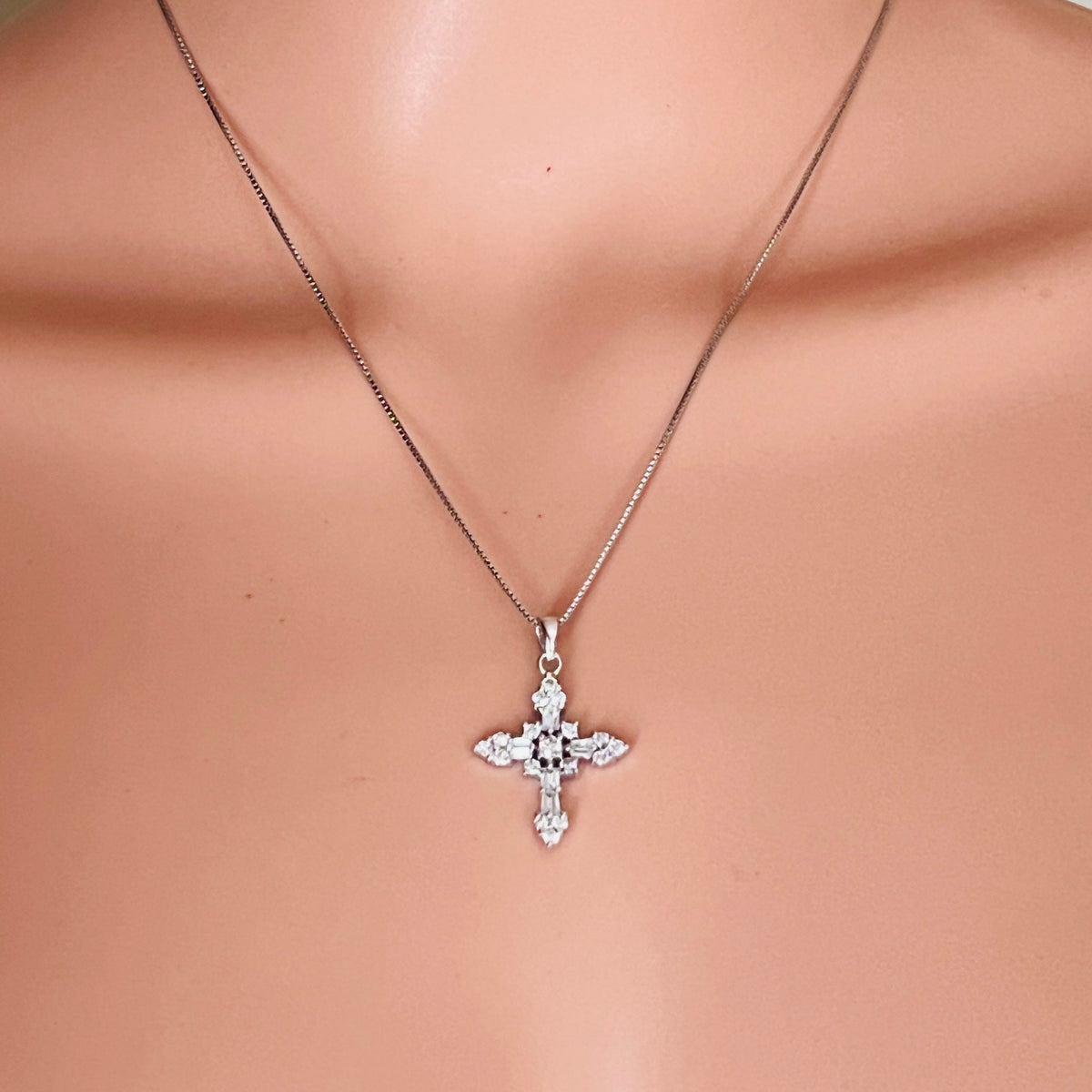 Sterling silver CZ cross necklace worn on mannequin