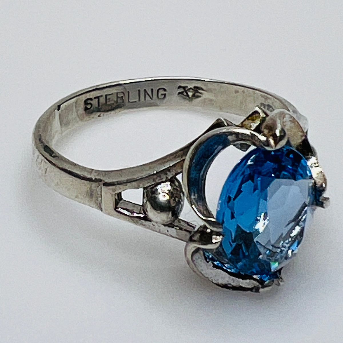 Inside band showing “STERLING” stamp and unidentified maker’s mark