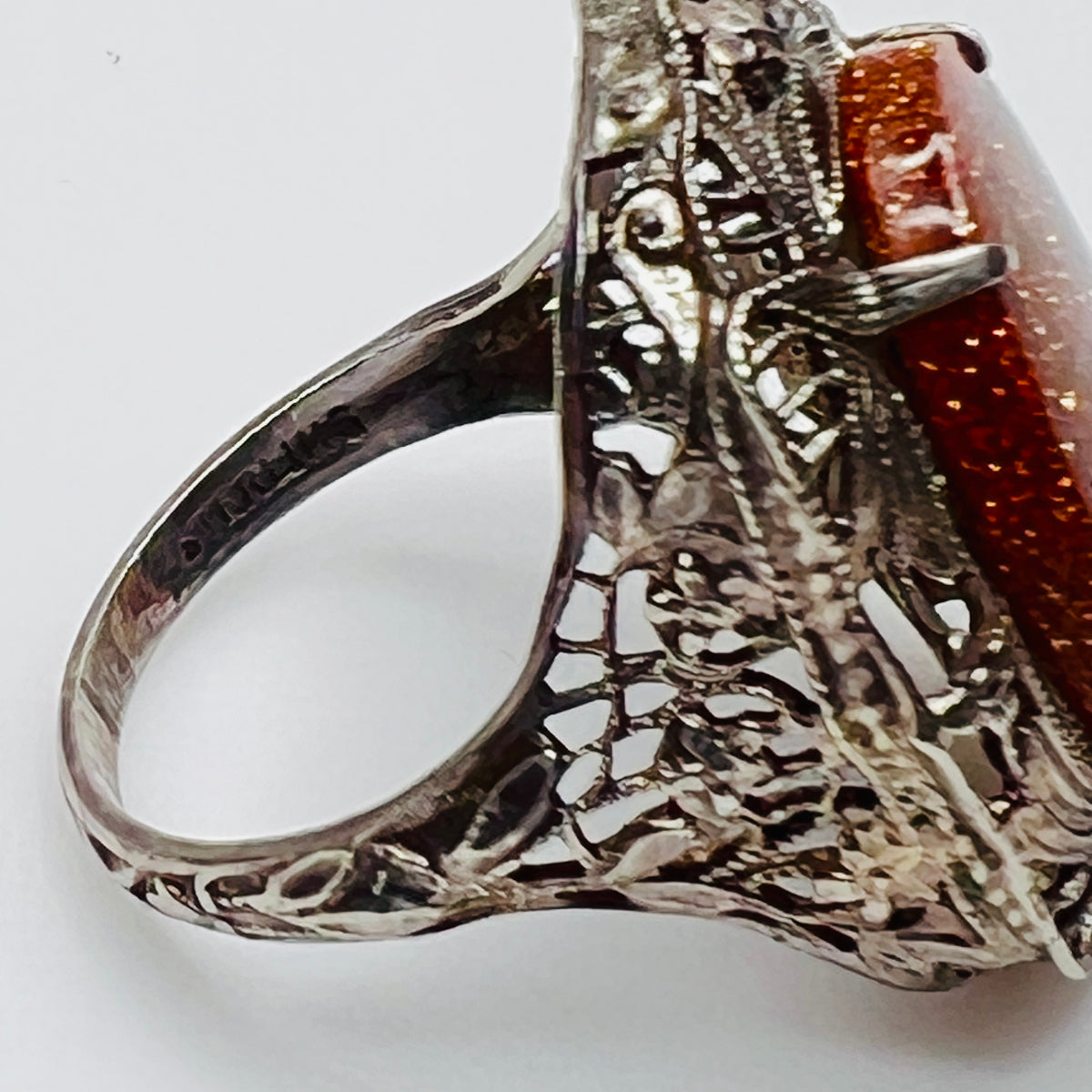 Statement vintage ring with ornate sterling floral filigree and oval goldstone
