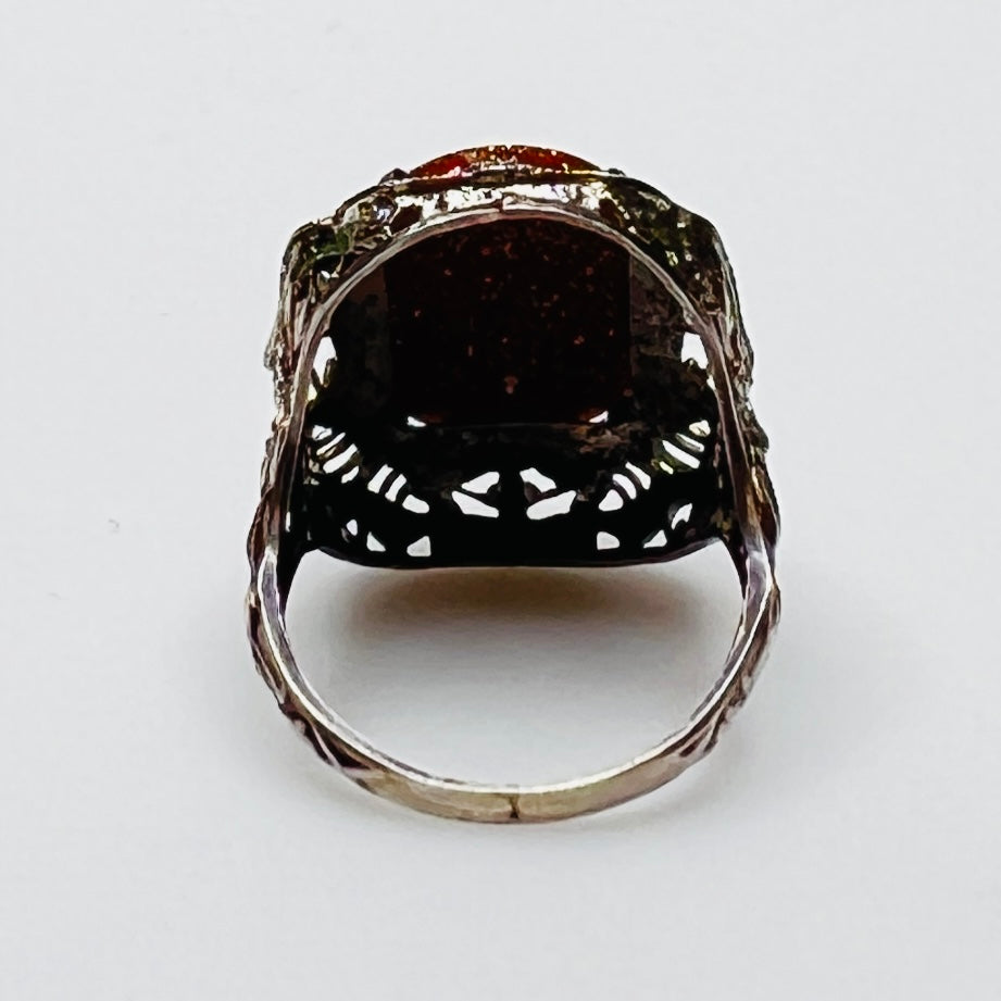 Statement vintage ring with ornate sterling floral filigree and oval goldstone