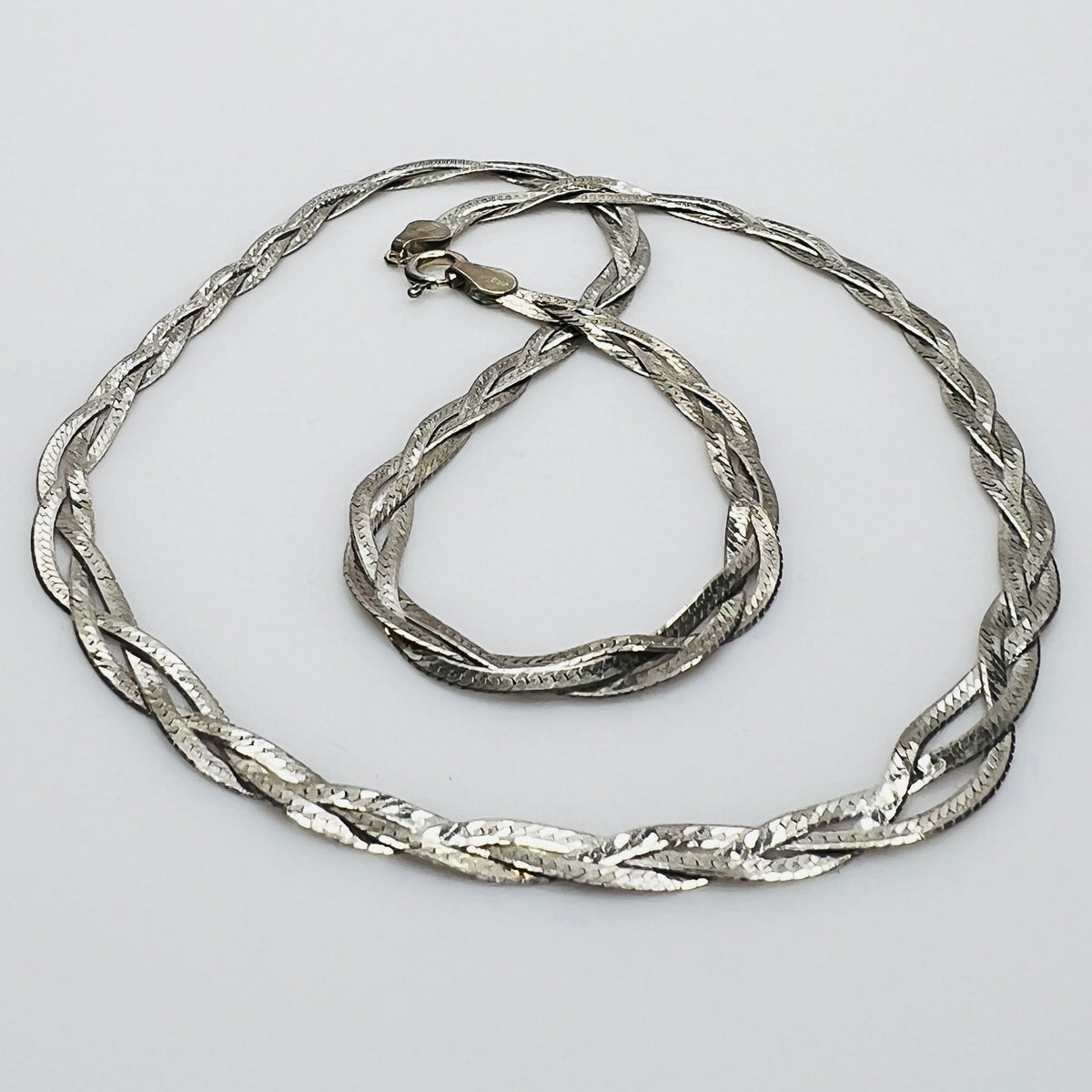 Flat twisted sterling silver necklace in woven design
