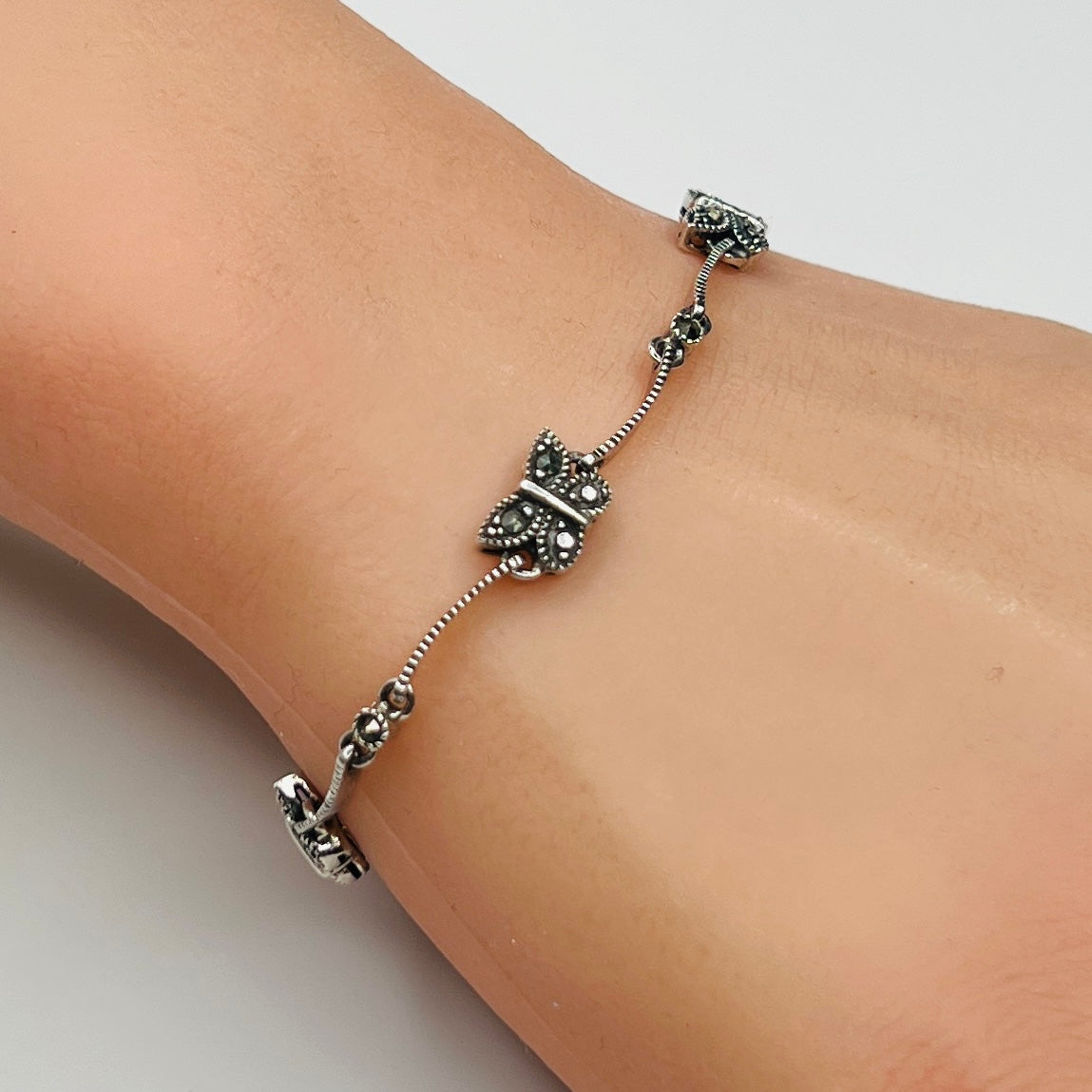 Sterling silver marcasite butterfly bracelet on wrist