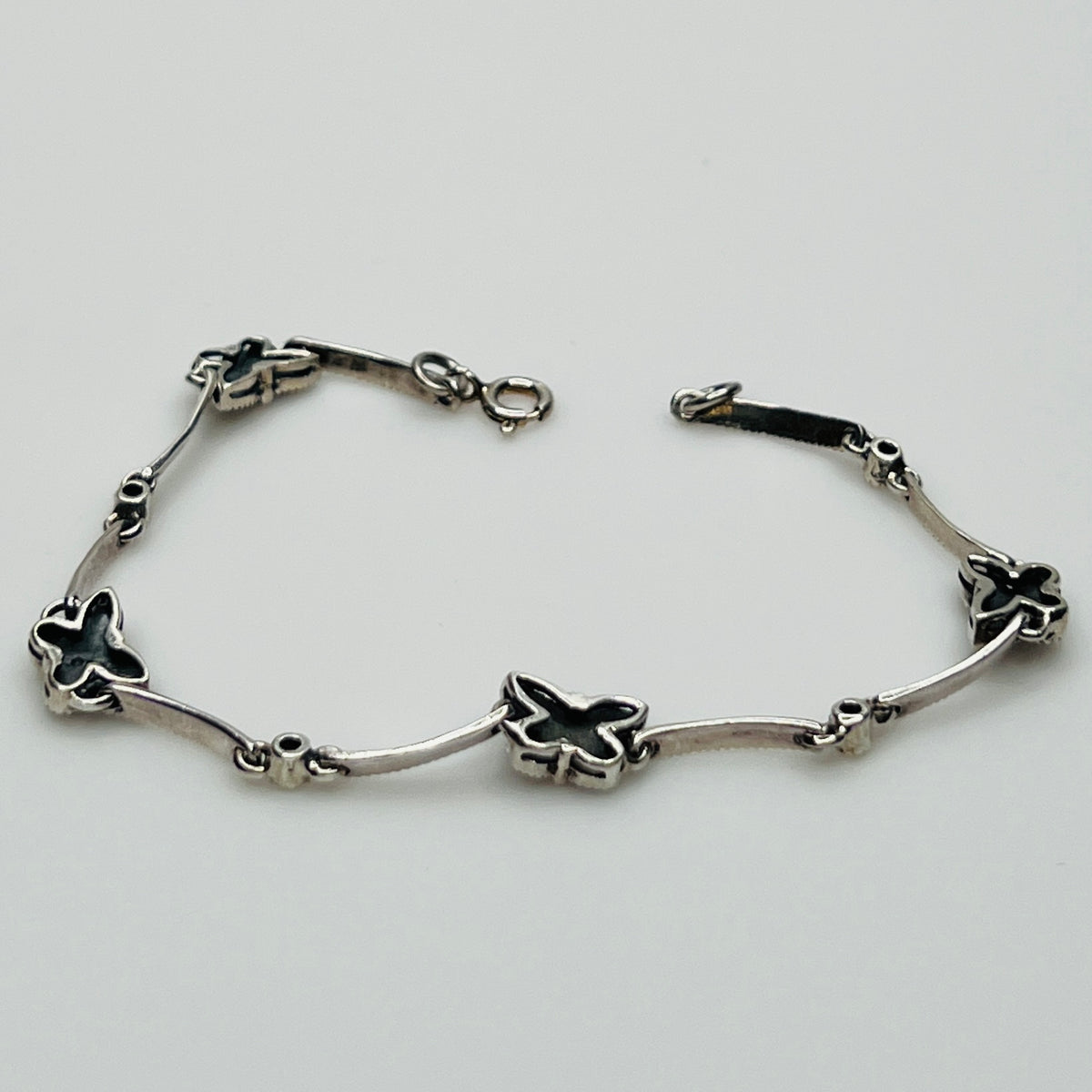 Overhead view of butterfly bracelet laid flat showing clasp and detail