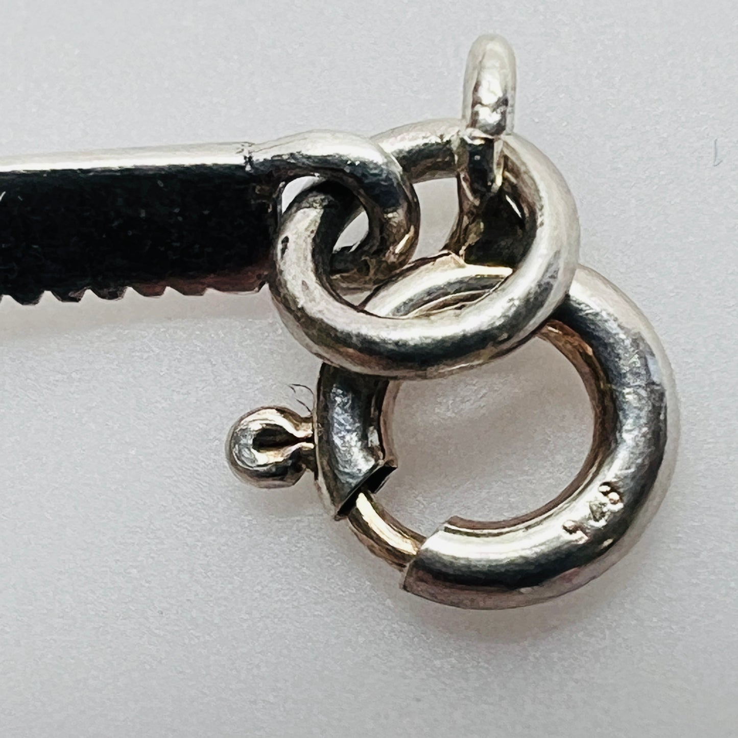 Overhead view of butterfly bracelet laid flat showing clasp and detail