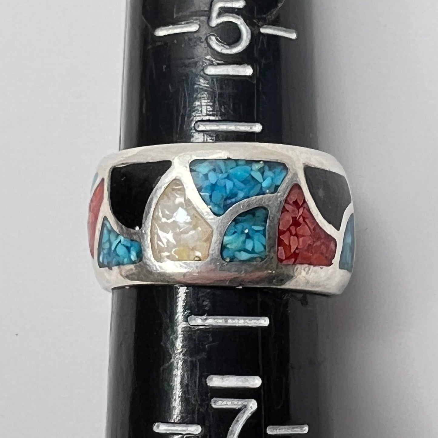 Ring on sizer measuring size 6, 10mm wide with multicolor inlay
