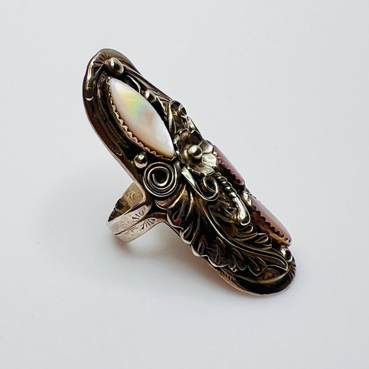 Southwestern vintage ring with floral and feather silver design, size 9