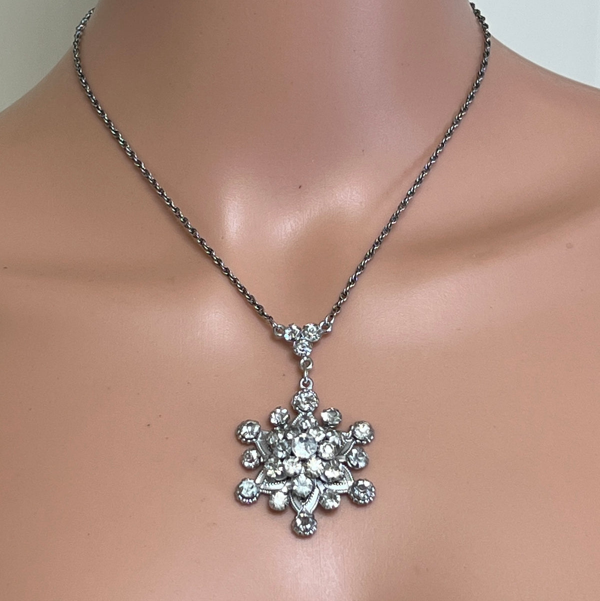 Sterling rhinestone flower pendant necklace on mannequin, vintage glamour style