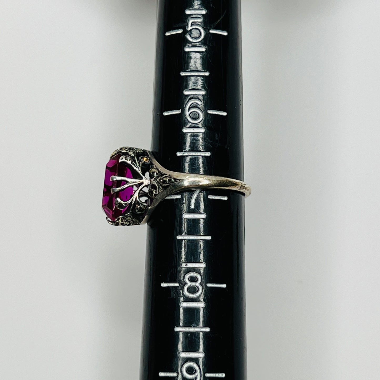 Close-up of pink crystal in sterling ring with antique detailing