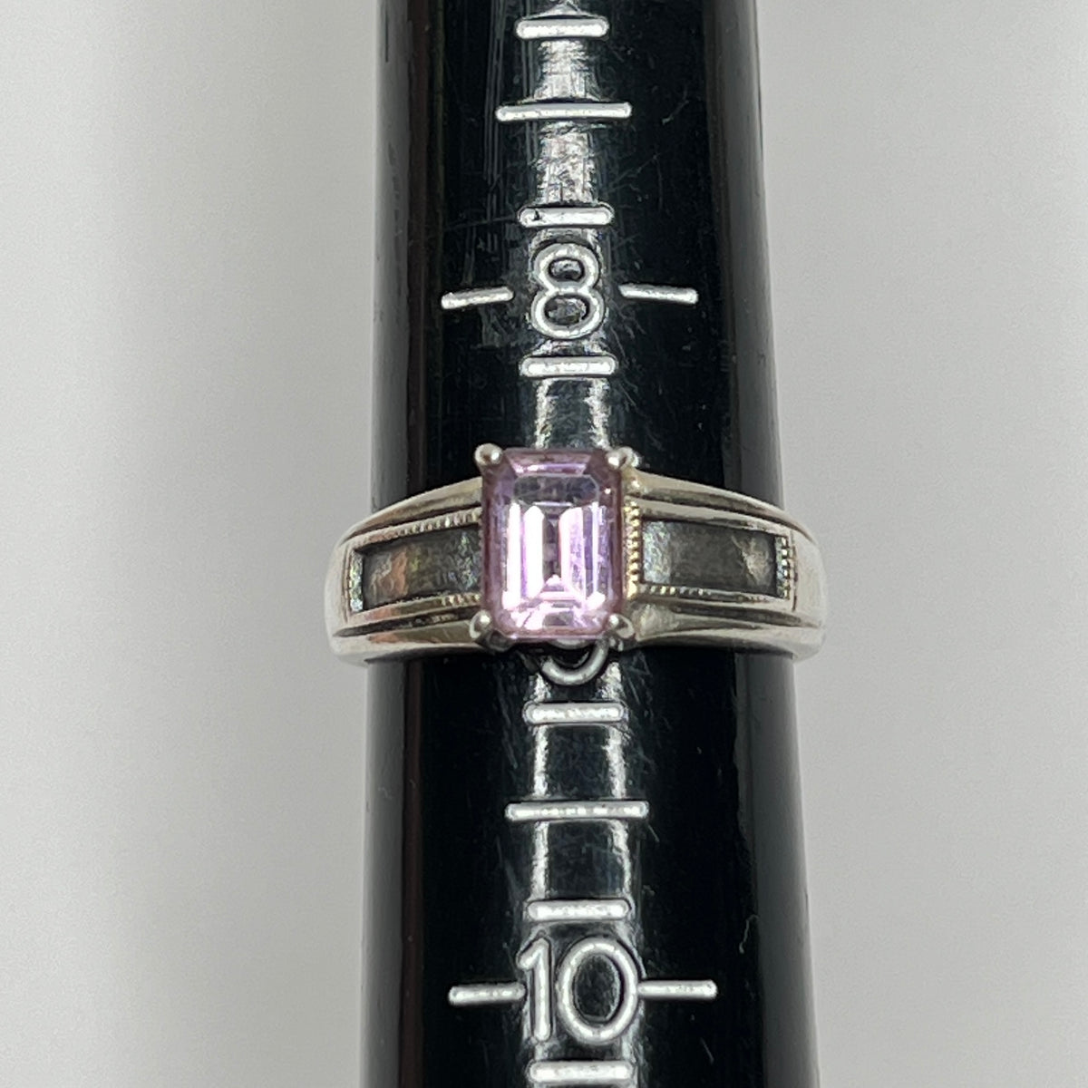 Close-up of vintage Art Deco style silver ring with pale purple spinel