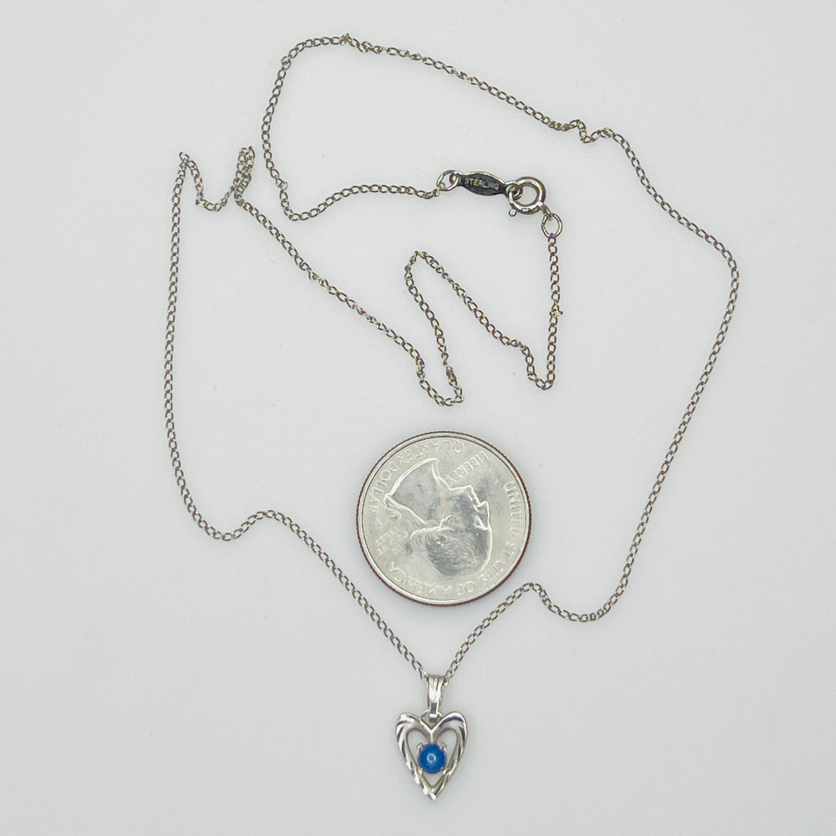 Delicate silver chain with sapphire heart pendant and spring ring clasp