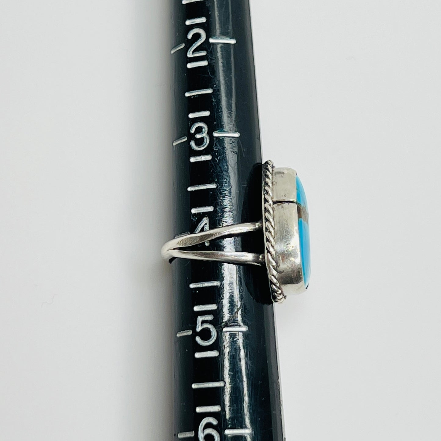 Ring shown on sizer, marked as size 4