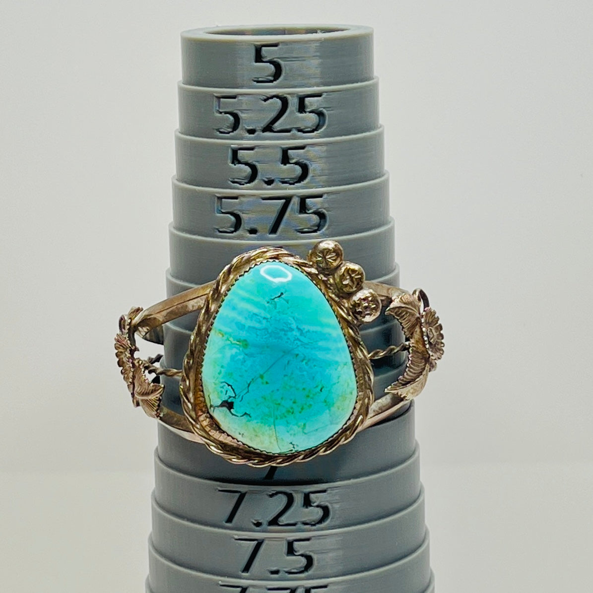 Vintage Native American turquoise and sterling silver cuff bracelet with floral motif