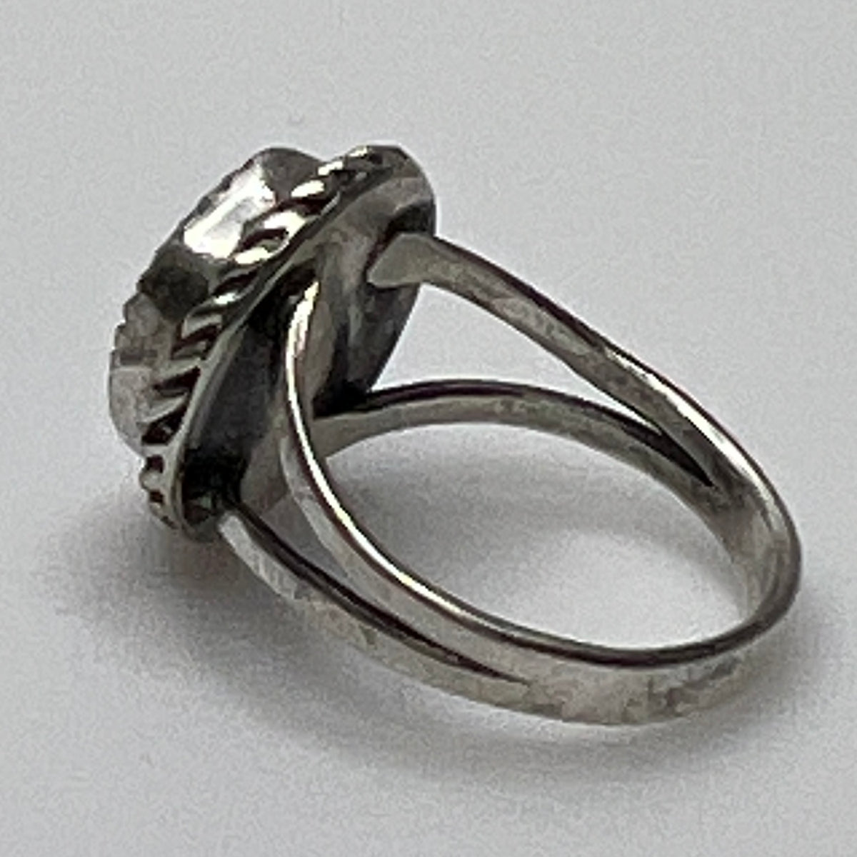 Side view of split shank turquoise ring in silver setting