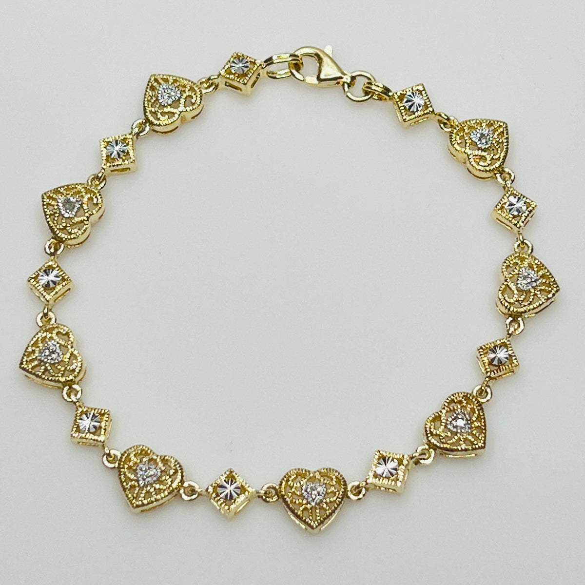 Vintage gold vermeil sterling silver bracelet and heart stud earrings with filigree detail