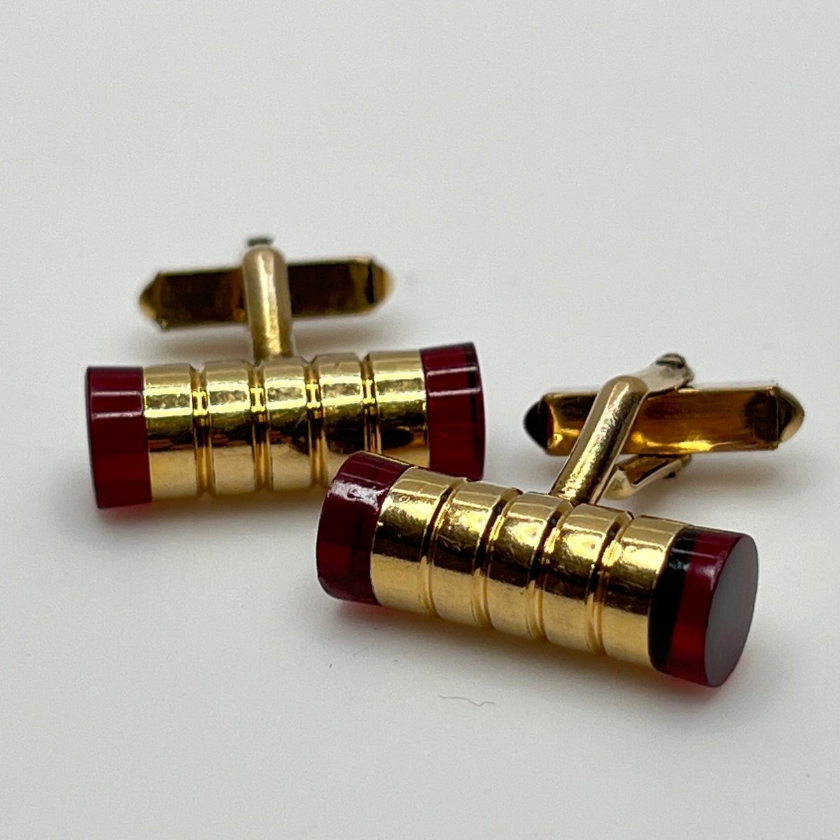 Pair of Swank gold-filled red Lucite tube cufflinks, mid-century style