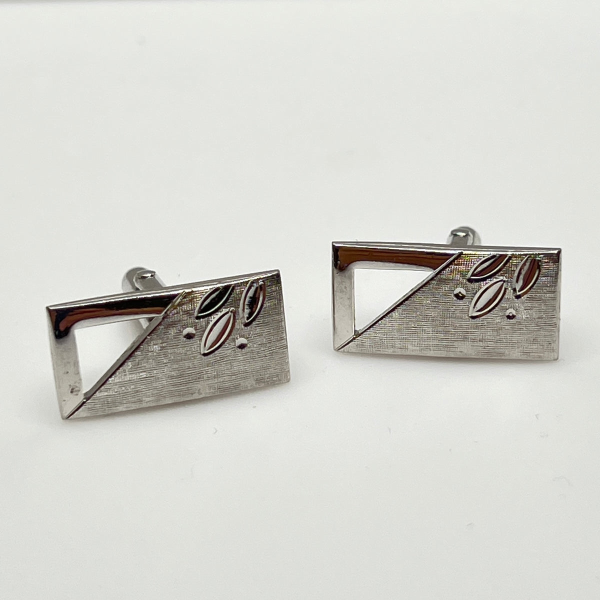 Silver-tone rectangular Swank cufflinks with Art Deco leaf and dot motif, mid-century vintage