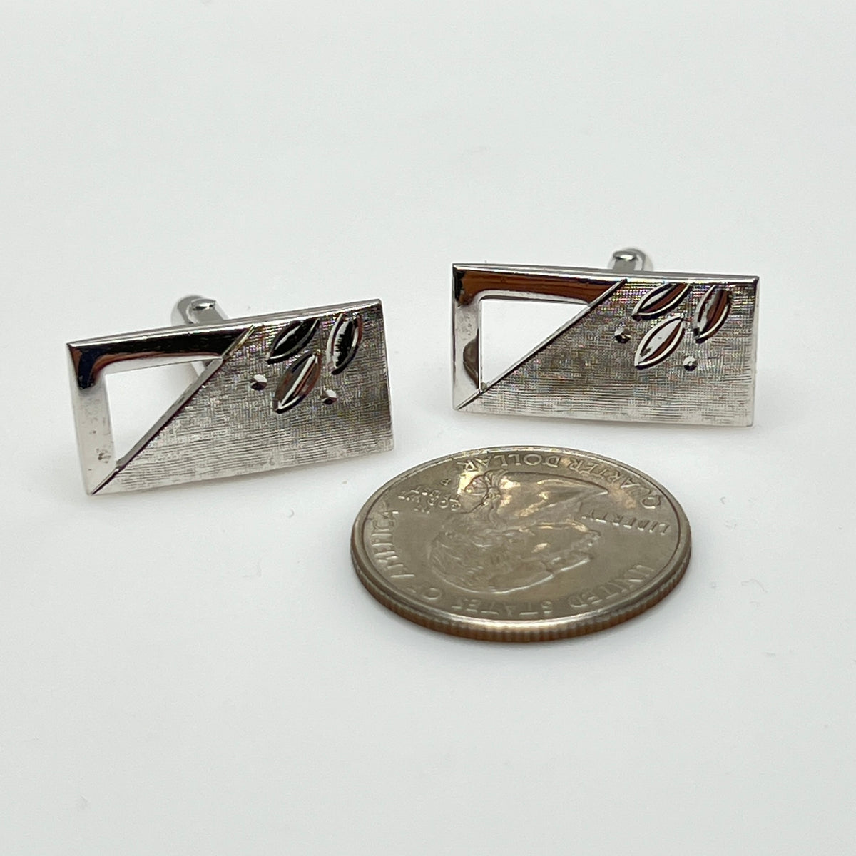 Silver-tone rectangular Swank cufflinks with Art Deco leaf and dot motif, mid-century vintage