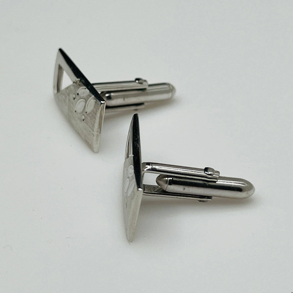 Silver-tone rectangular Swank cufflinks with Art Deco leaf and dot motif, mid-century vintage