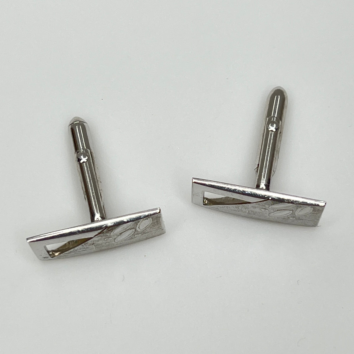 Silver-tone rectangular Swank cufflinks with Art Deco leaf and dot motif, mid-century vintage
