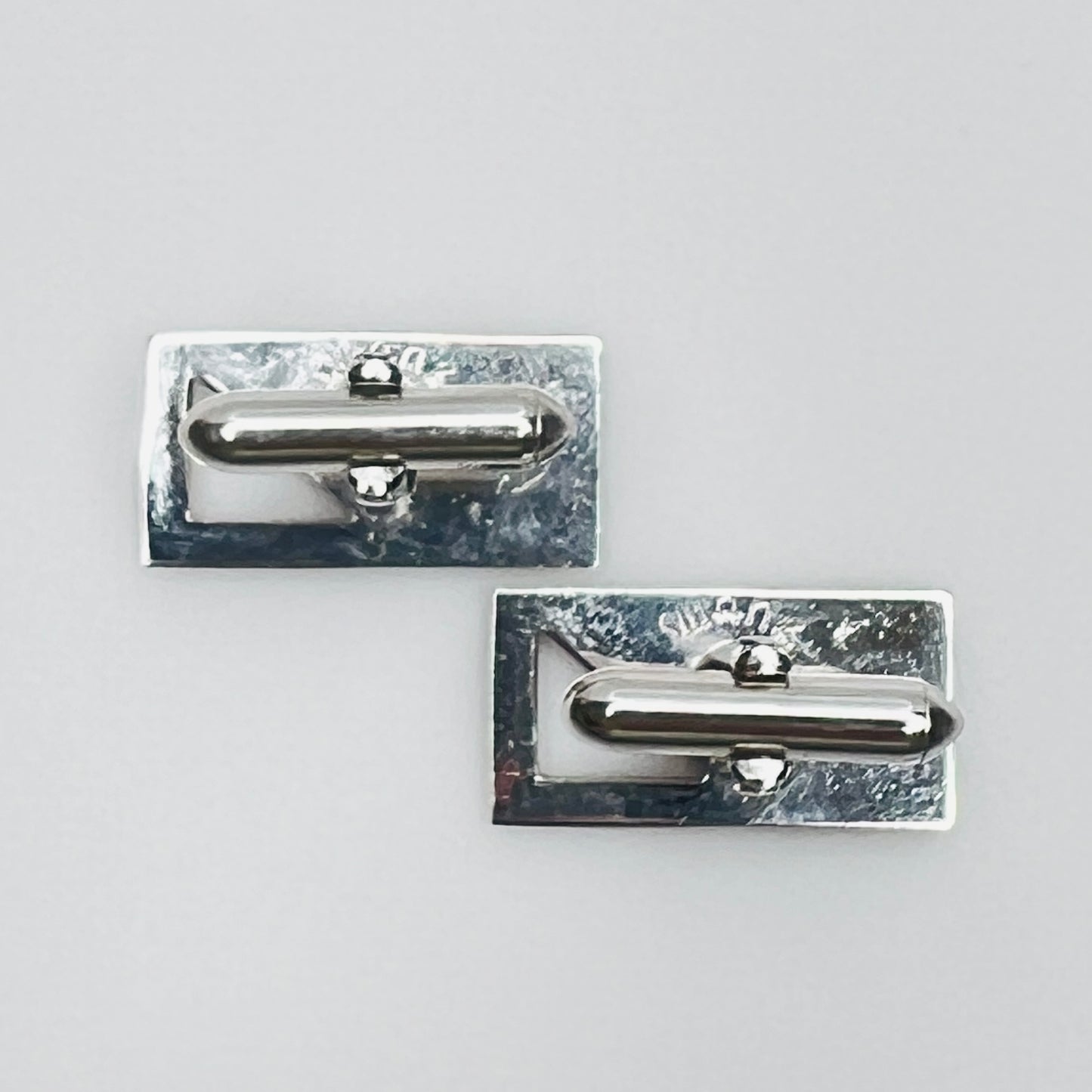 Silver-tone rectangular Swank cufflinks with Art Deco leaf and dot motif, mid-century vintage