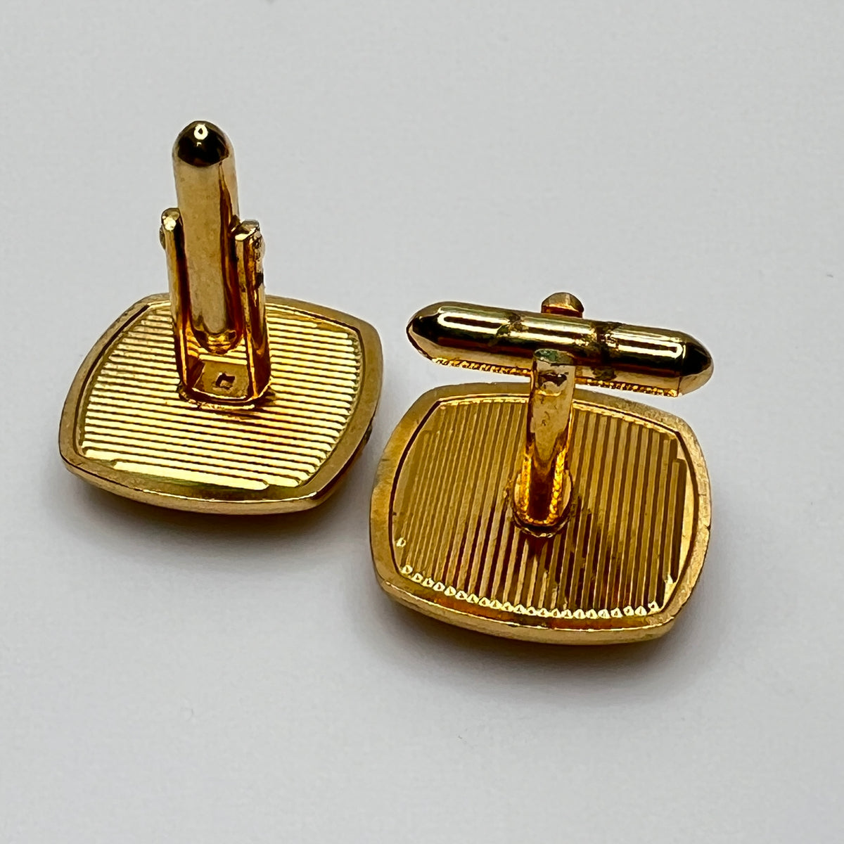 Square goldtone cufflinks with large tiger’s eye cabochons