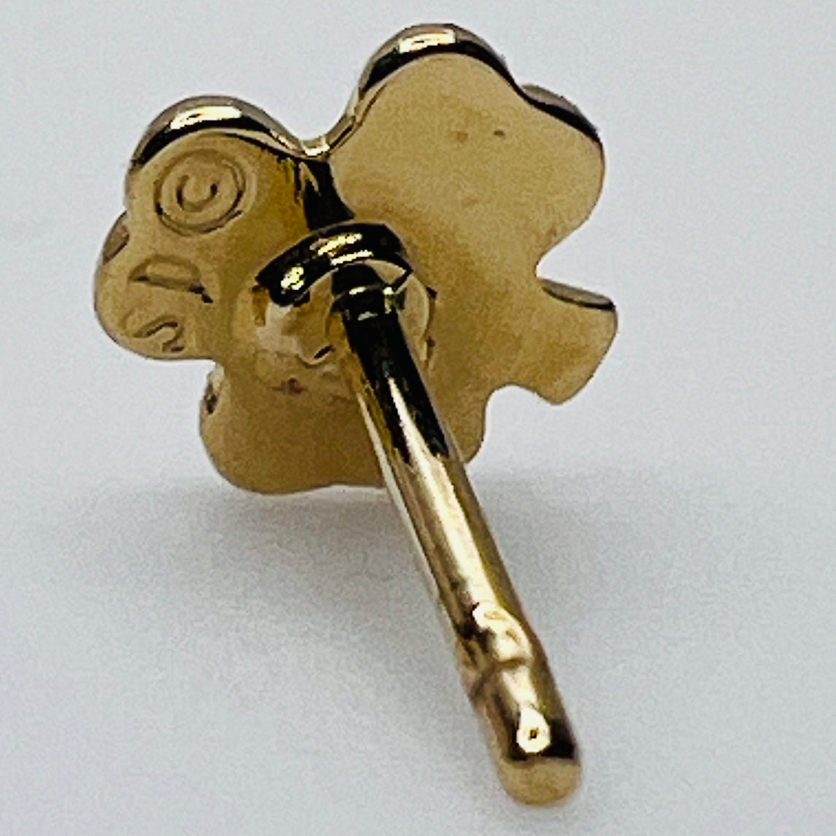 Close-up of earring back showing SD maker’s mark and 14K gold post