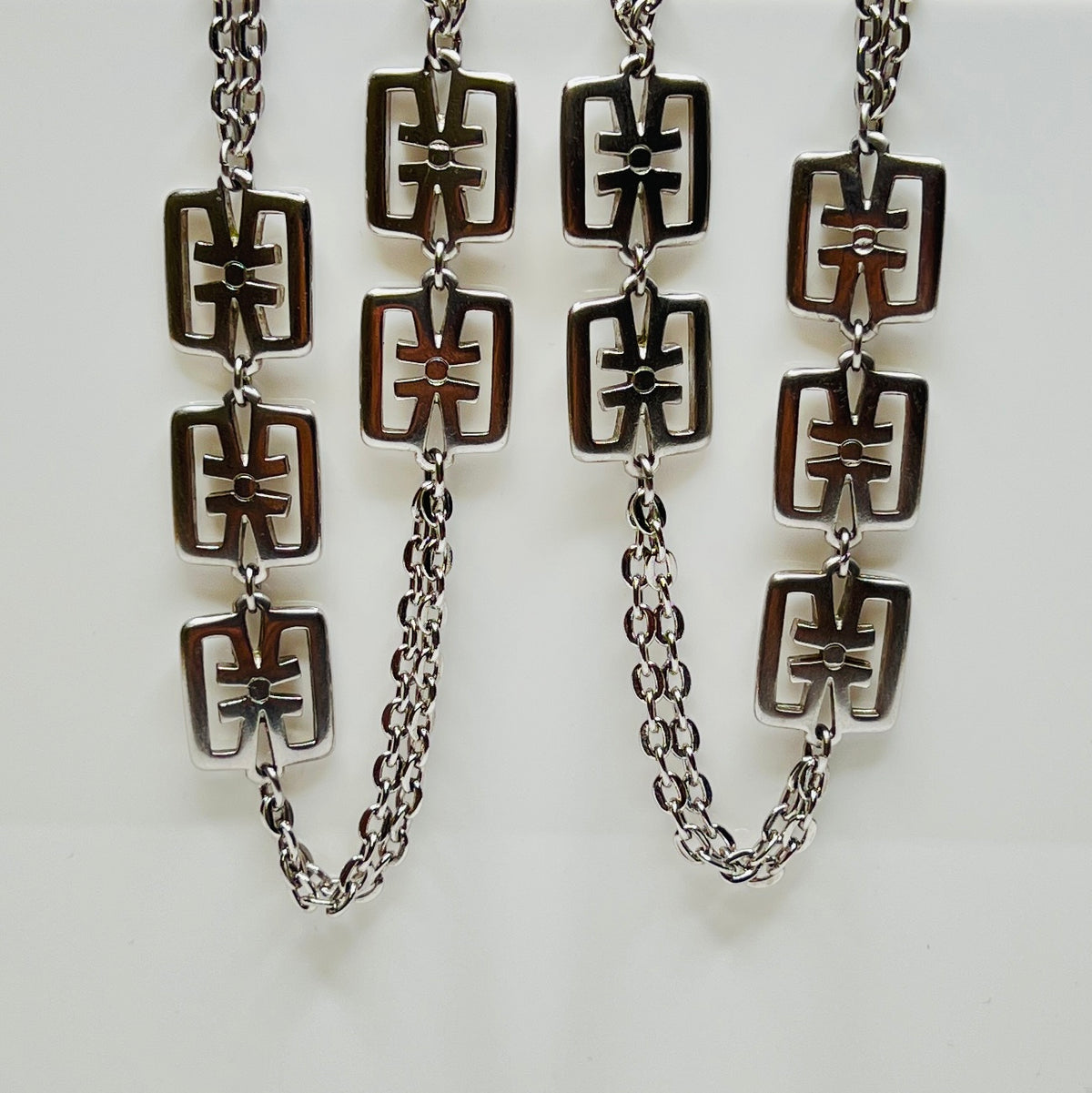 Close-up of flapper-length necklace doubled for styling