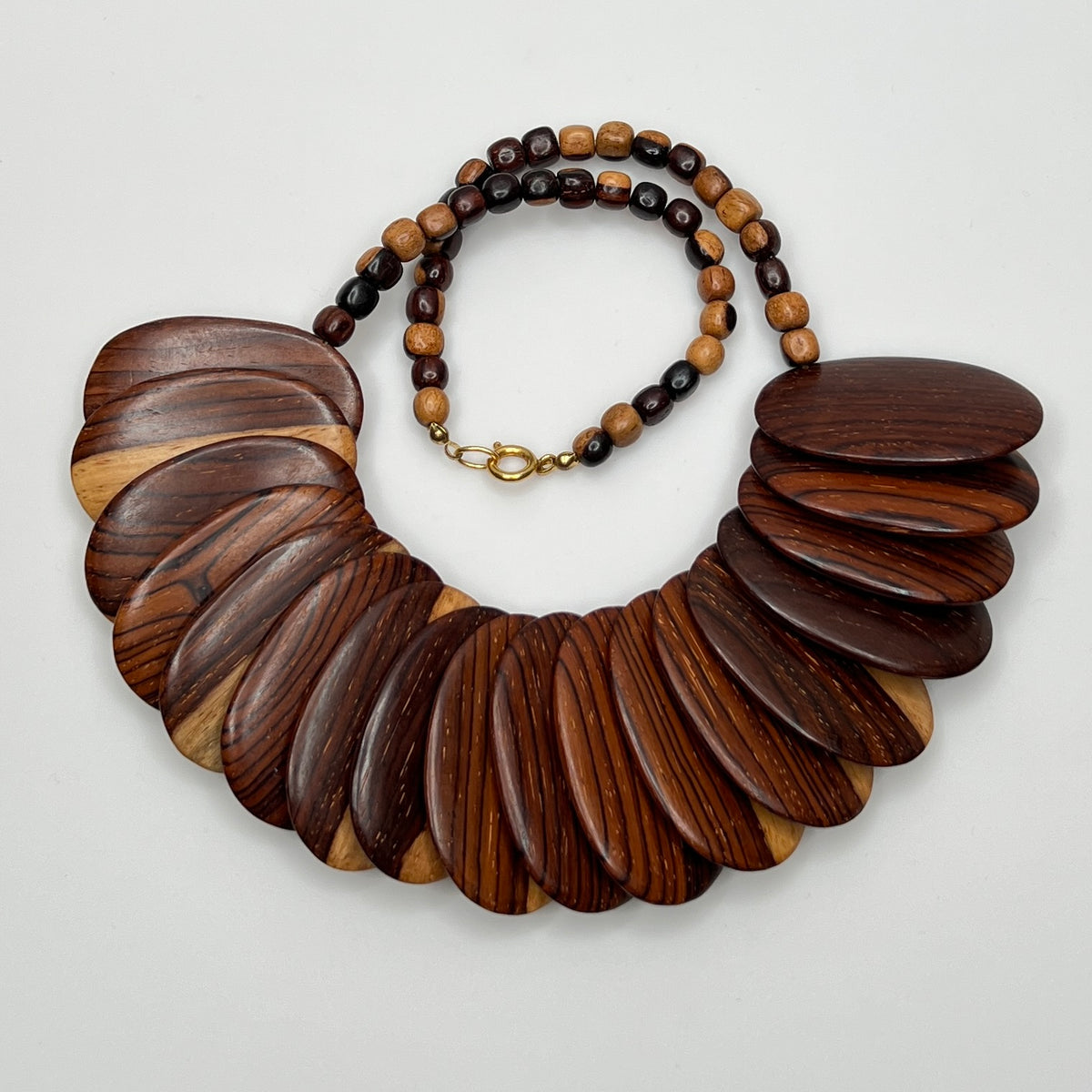 Full necklace layout showing bold fan-like bead design