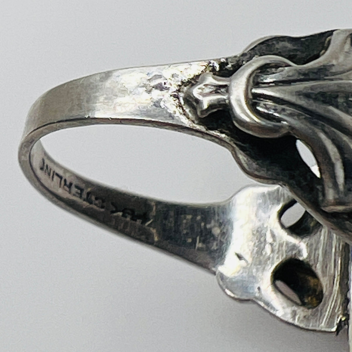 Interior band stamped "STERLING" with Uncas maker’s mark