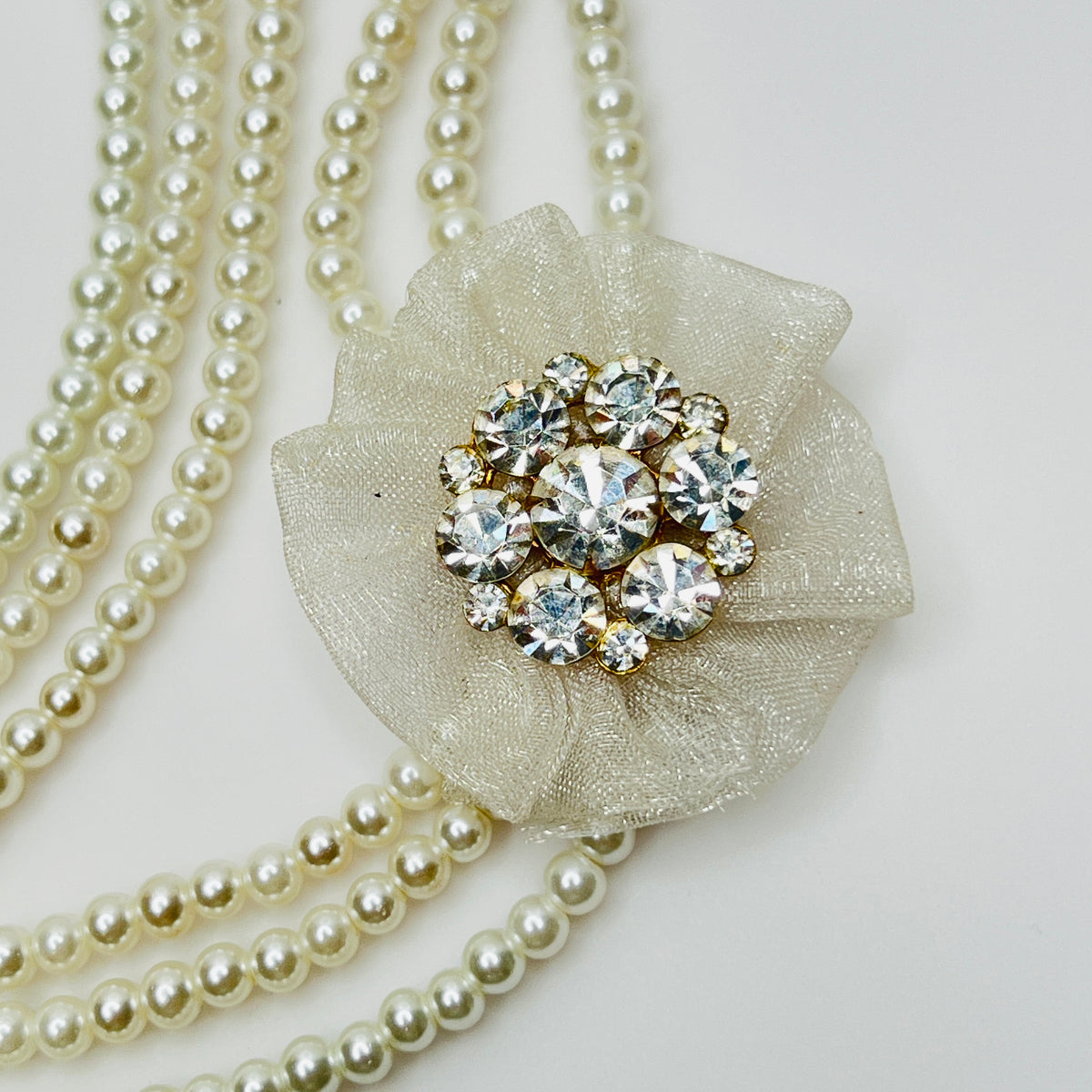 Vintage 3-strand glass pearl necklace with chiffon flower and rhinestone brooch centerpiece