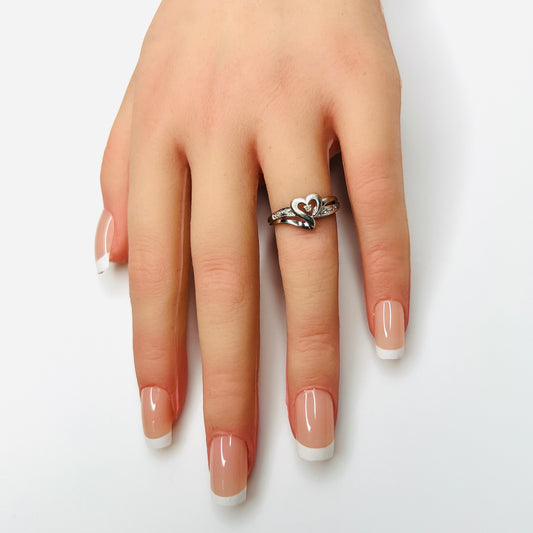 Vintage 1980s white gold diamond heart ring shown on hand