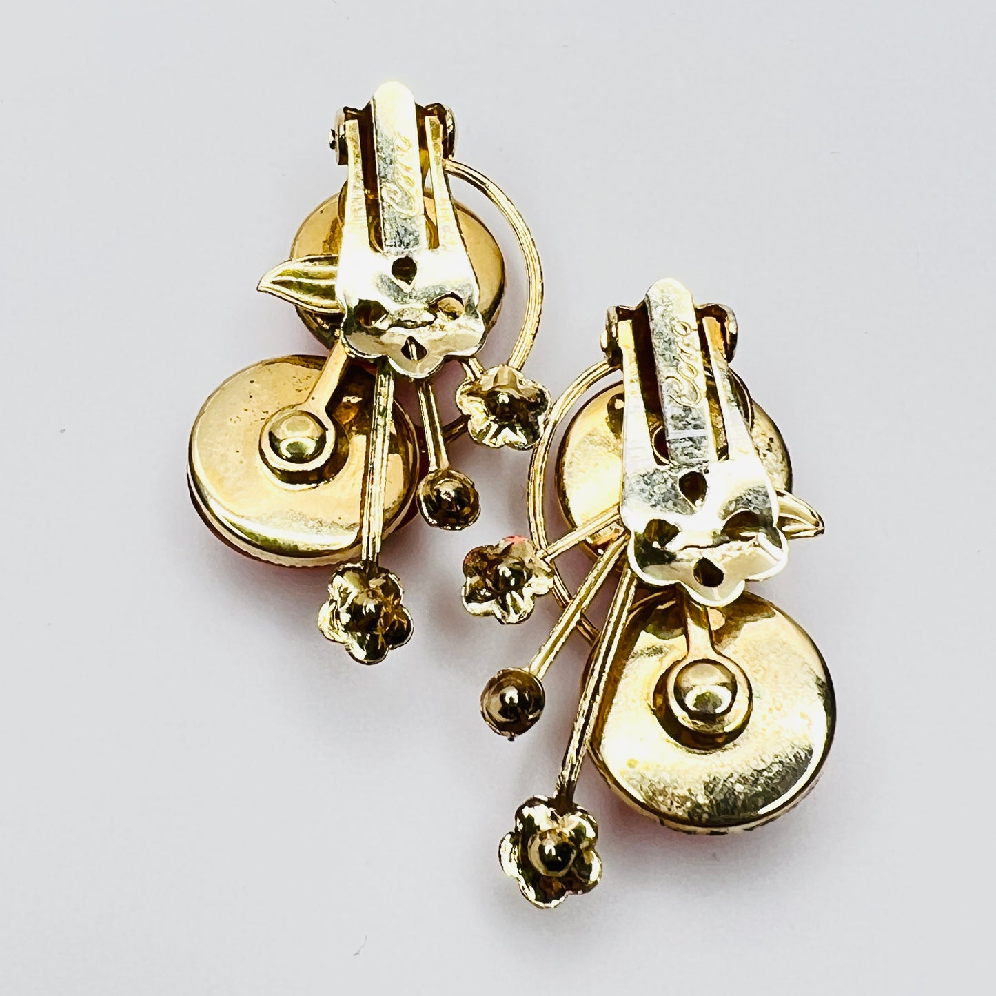 Back view signed Coro clip on earrings gold tone setting