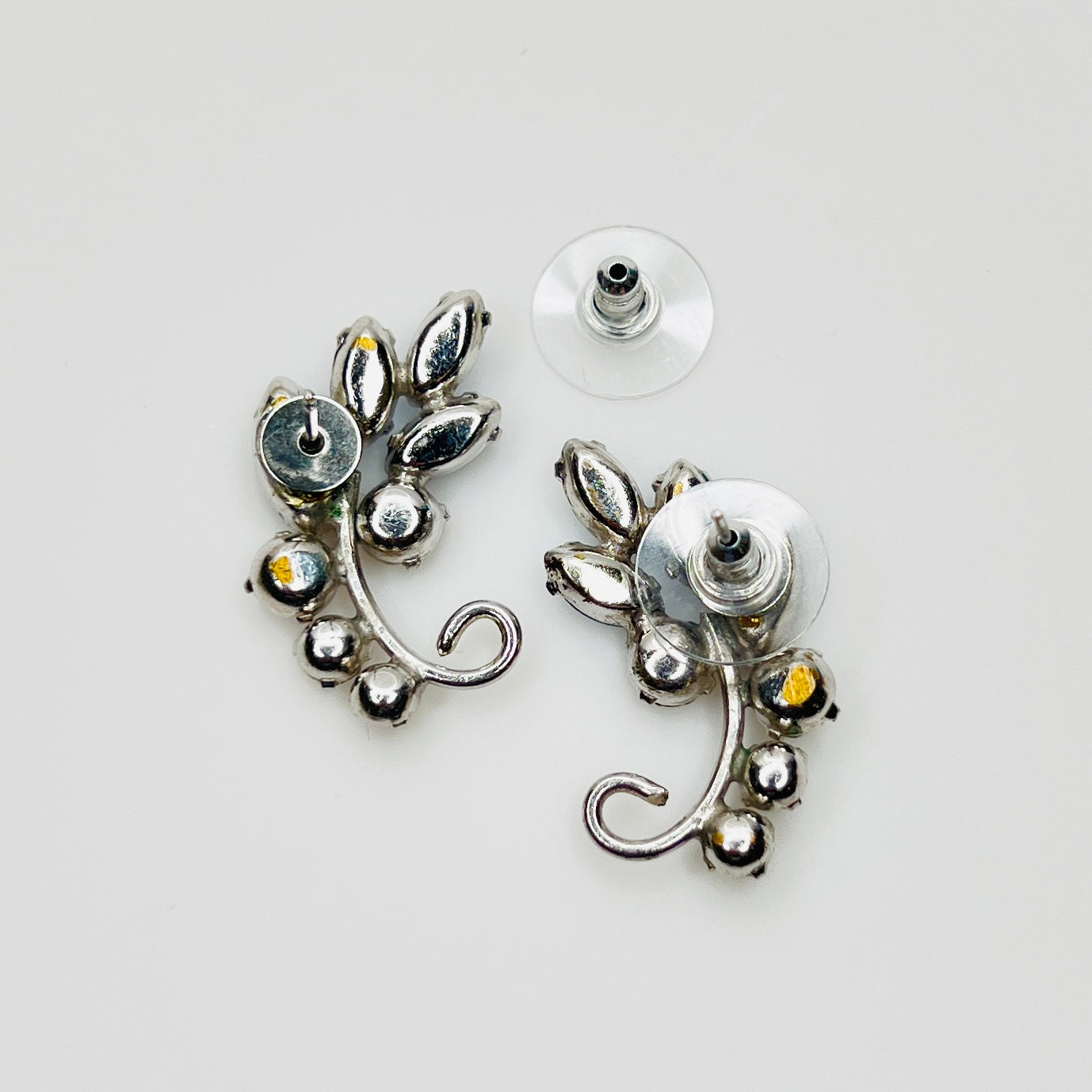 Reverse of converted 1950s rhinestone earrings with pierced stud backs