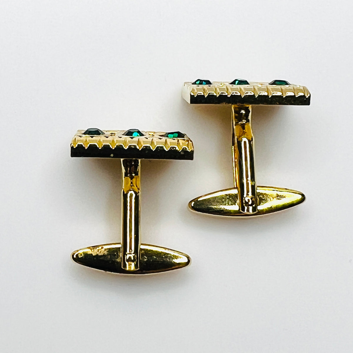 Top Side view of vintage West Germany rhinestone cufflinks showing swivel toggle closures