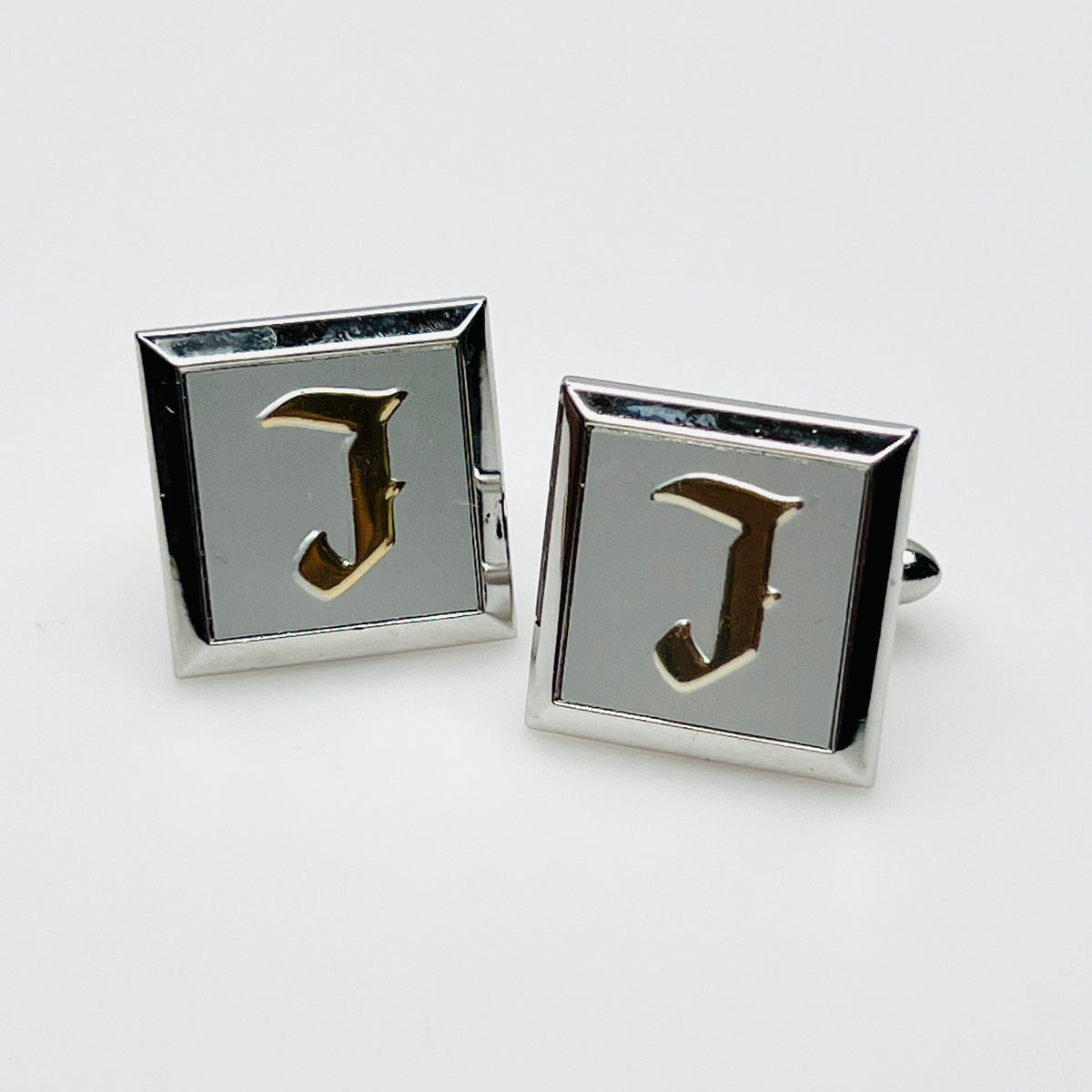 Vintage 1970s Swank square silver tone cufflinks with raised gold tone letter J monograms