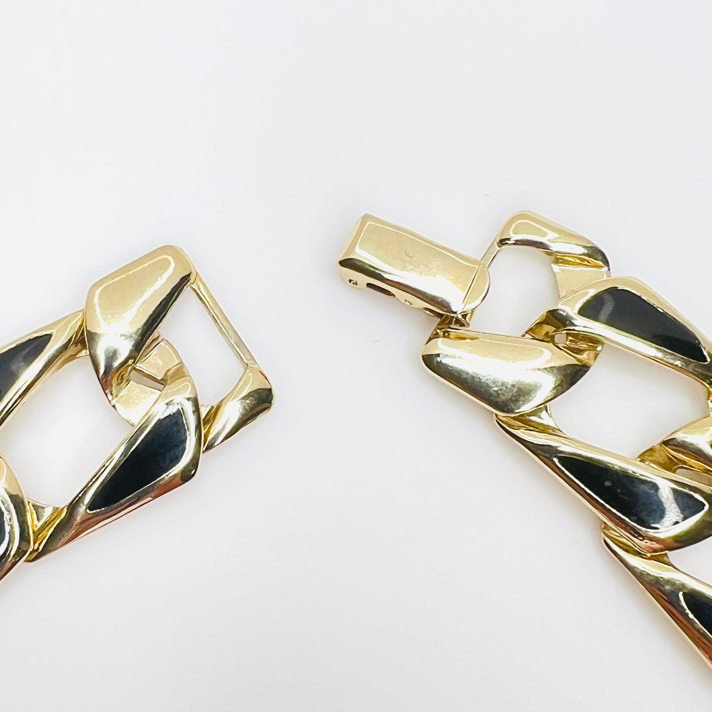 Vintage gold tone black enamel necklace with fold-over box clasp detail.
