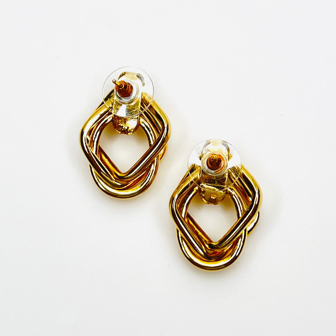 Back view of vintage gold tone pierced earrings with stabilizer backs