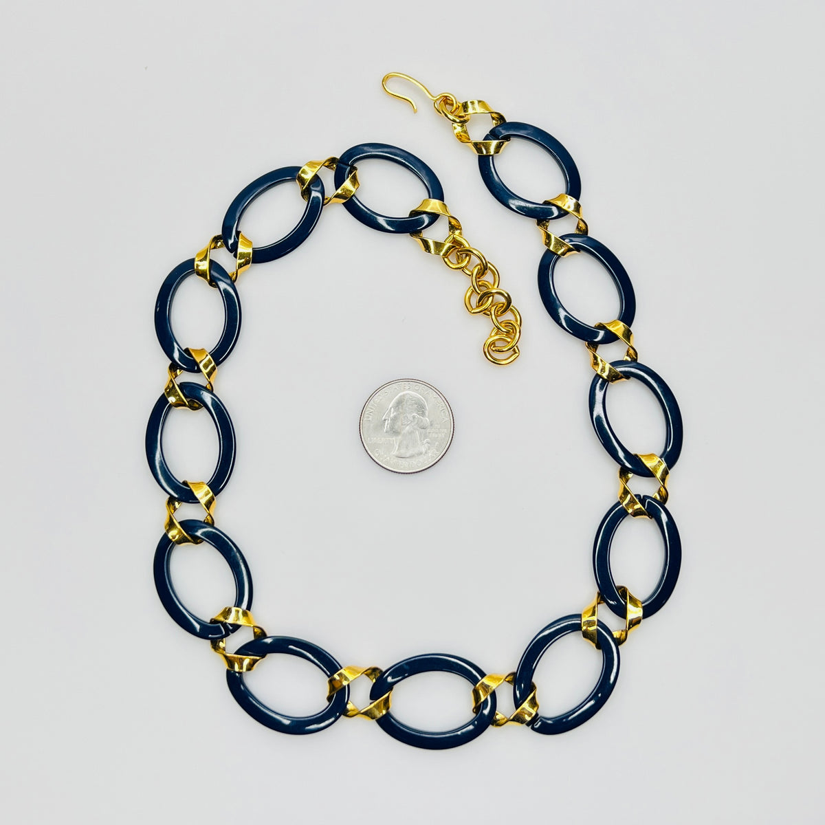 Monet navy blue enamel chain necklace with gold links flat lay