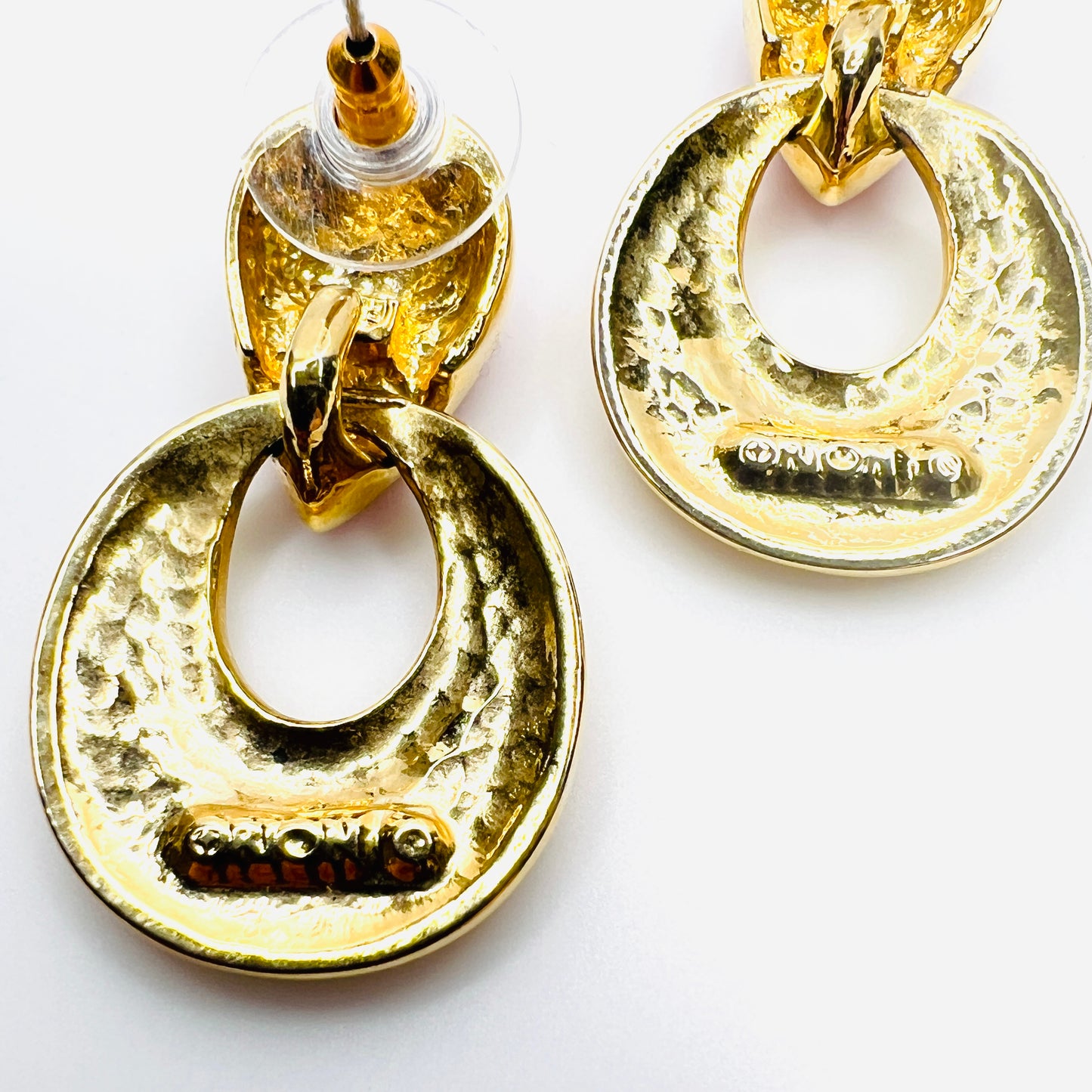 Close up of Signed Orion mark on reverse of vintage door knocker earrings