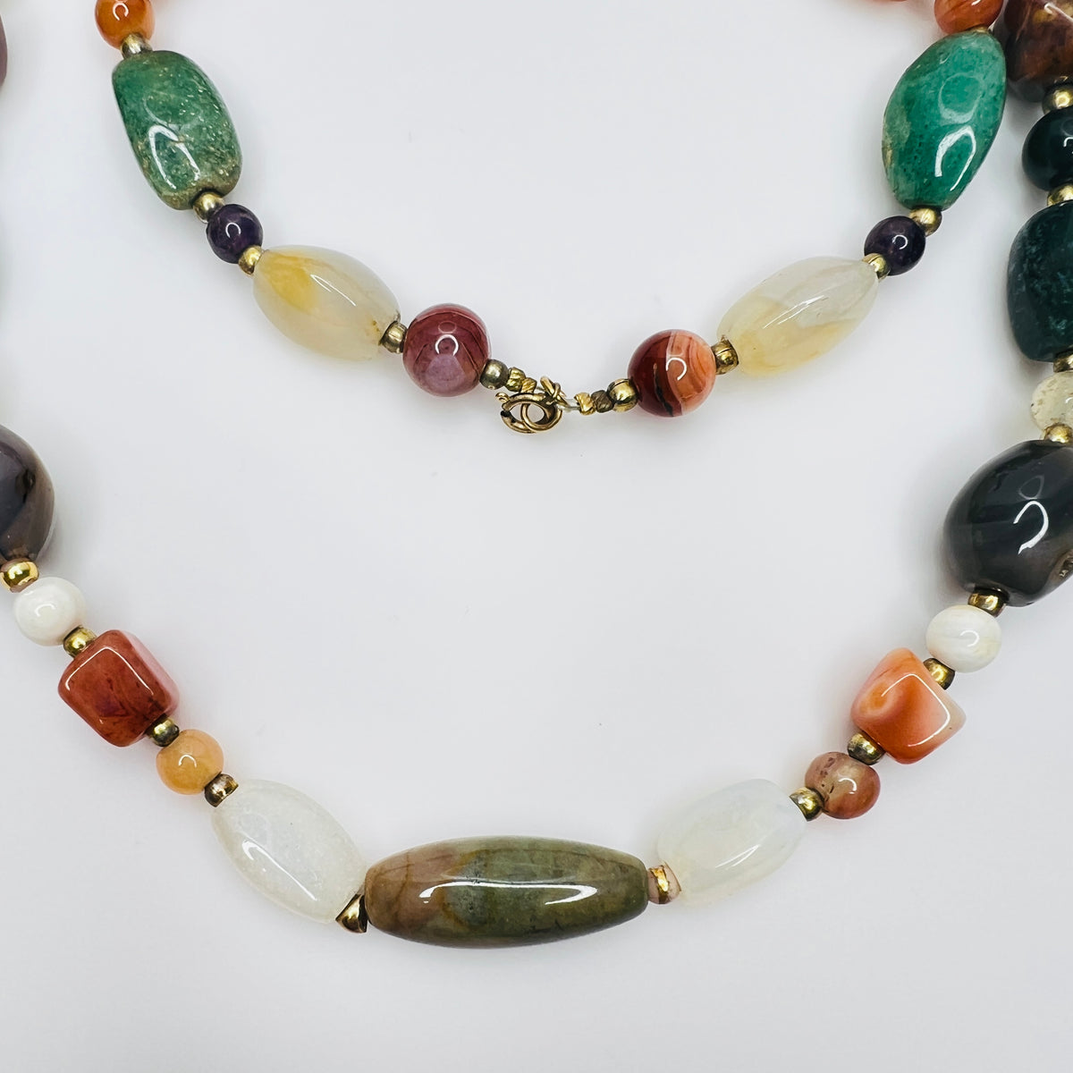 Vintage gemstone necklace with assorted polished stones and clasp