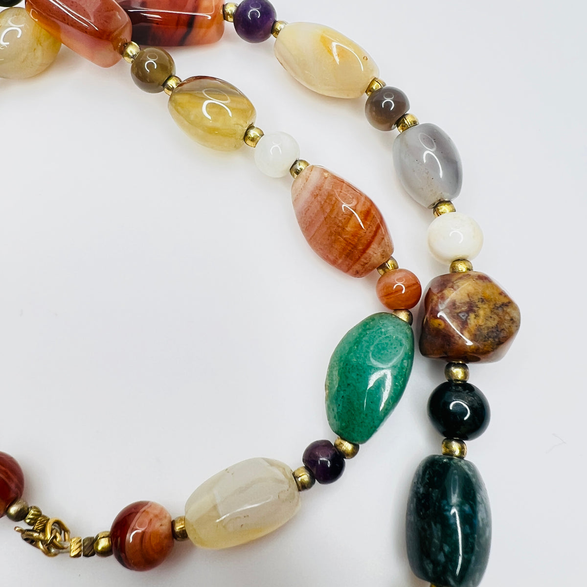 Detail of natural stone beads in vintage gemstone necklace