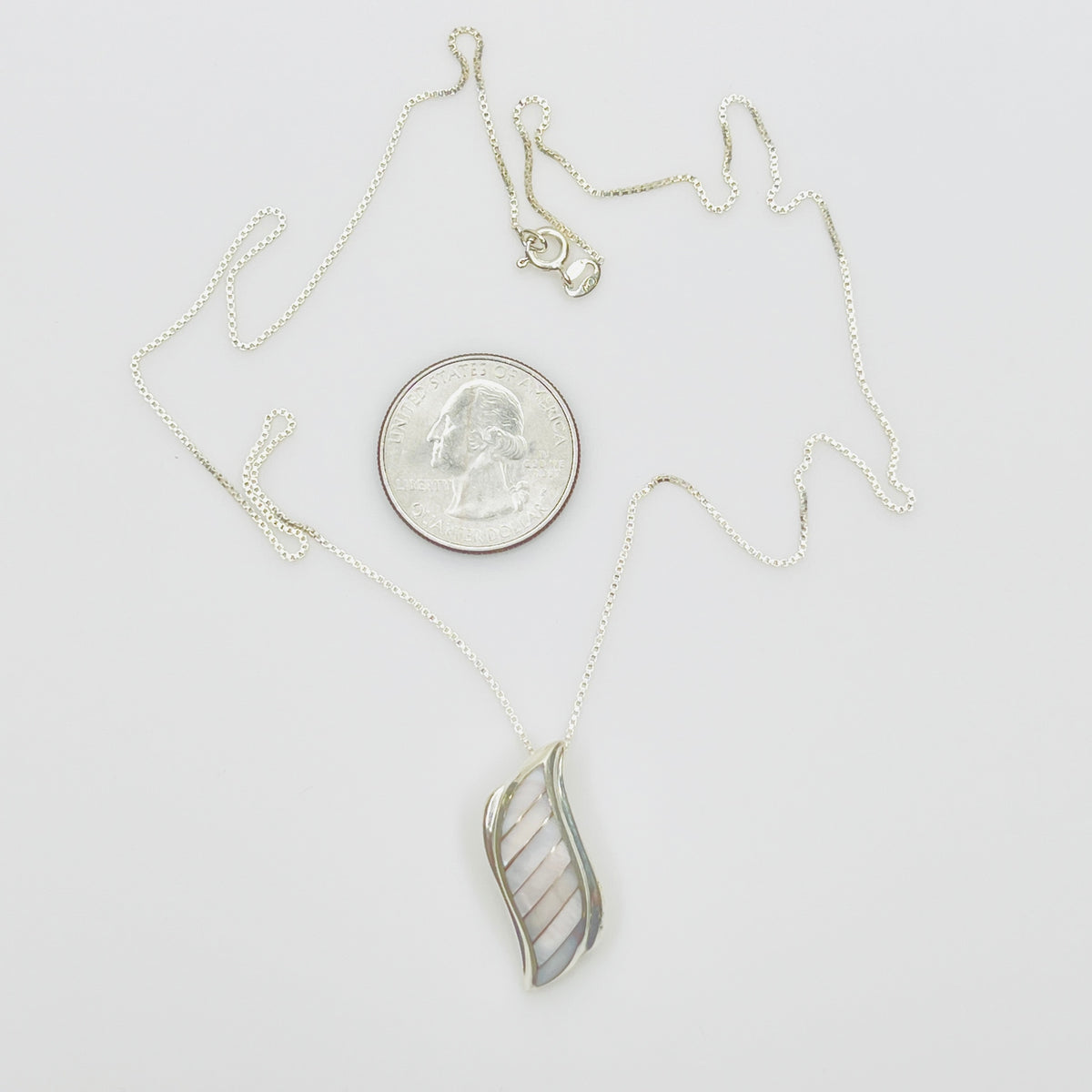 Vintage silver pendant with iridescent shell inlay curved design