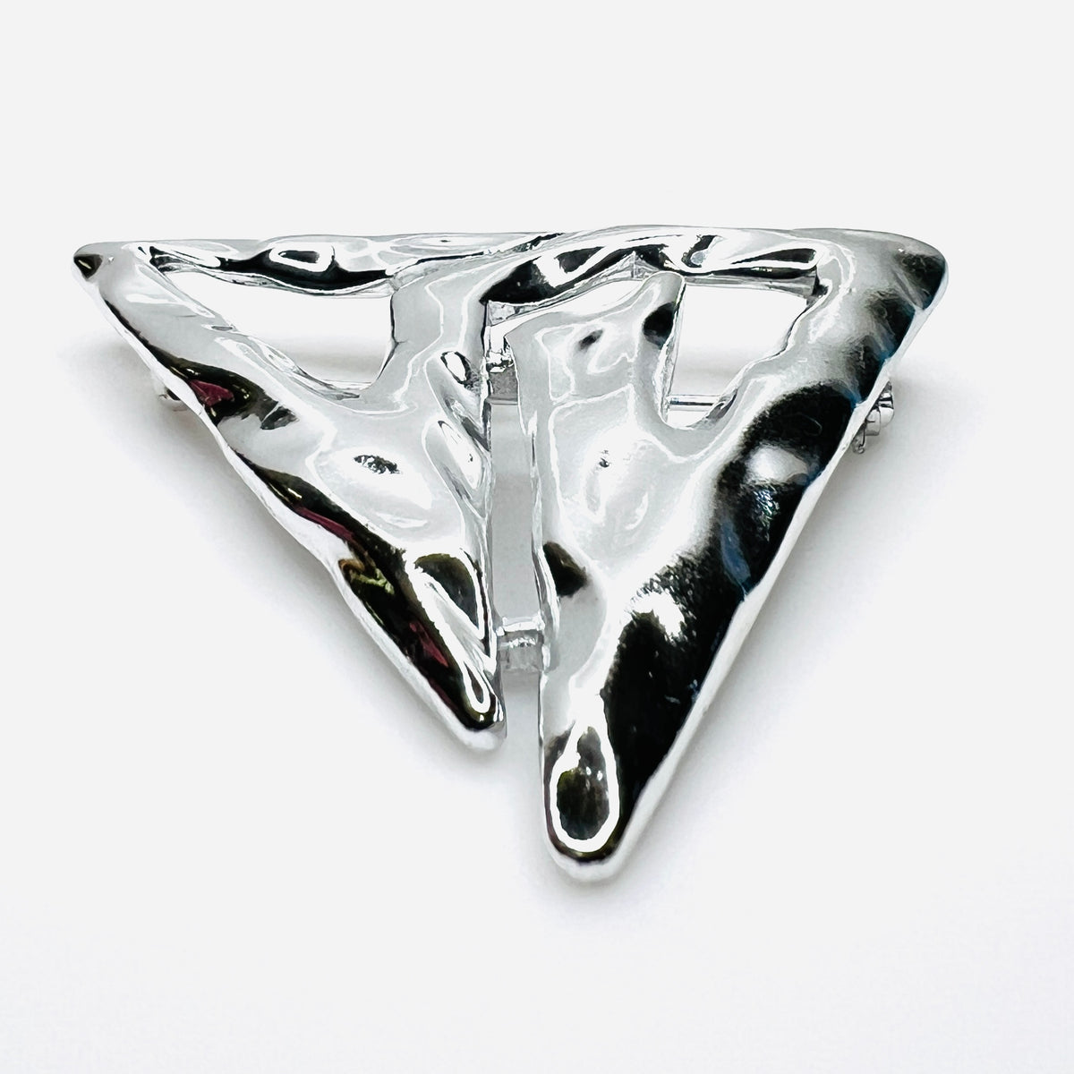 Side profile of vintage Torino abstract geometric brooch showing dimensional sculptural form.