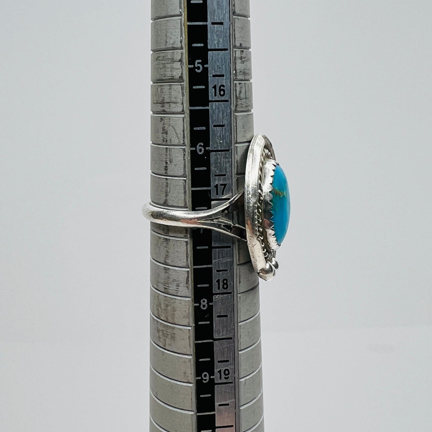 Turquoise ring on mandrel showing size and profile