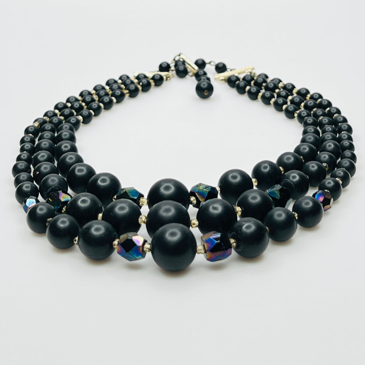 Layered matte black bead necklace with iridescent crystal accents