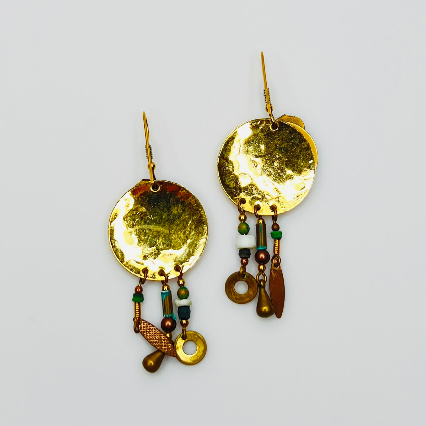 Back view hammered gold tone disc boho earrings