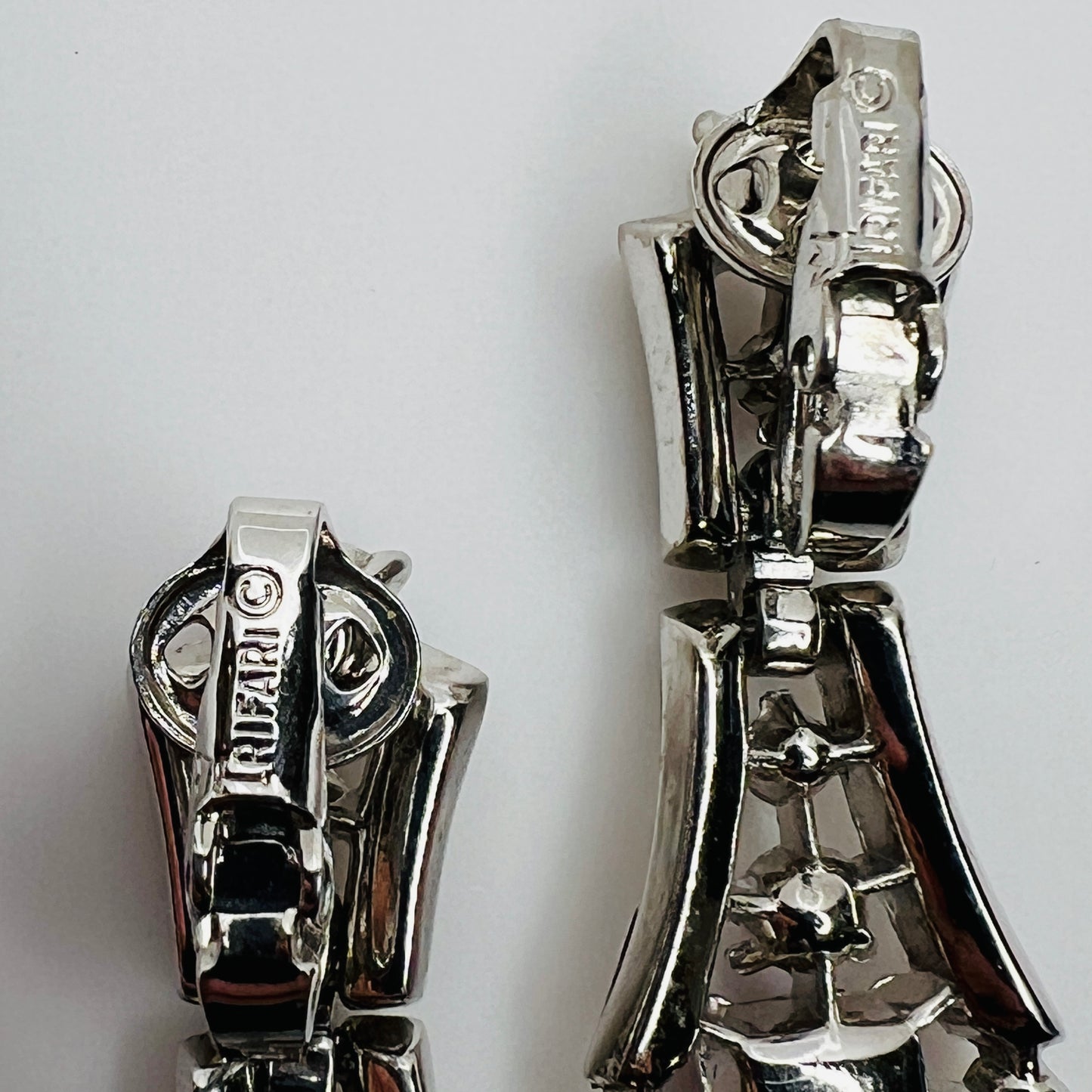 Back of earrings signed Crown Trifari clip backs
