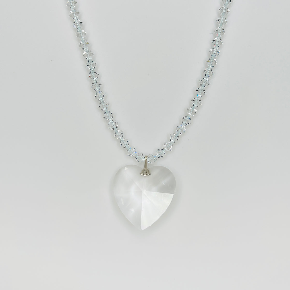 Vintage crystal heart pendant necklace with faceted clear crystal heart and sparkling crystal bicone bead strand