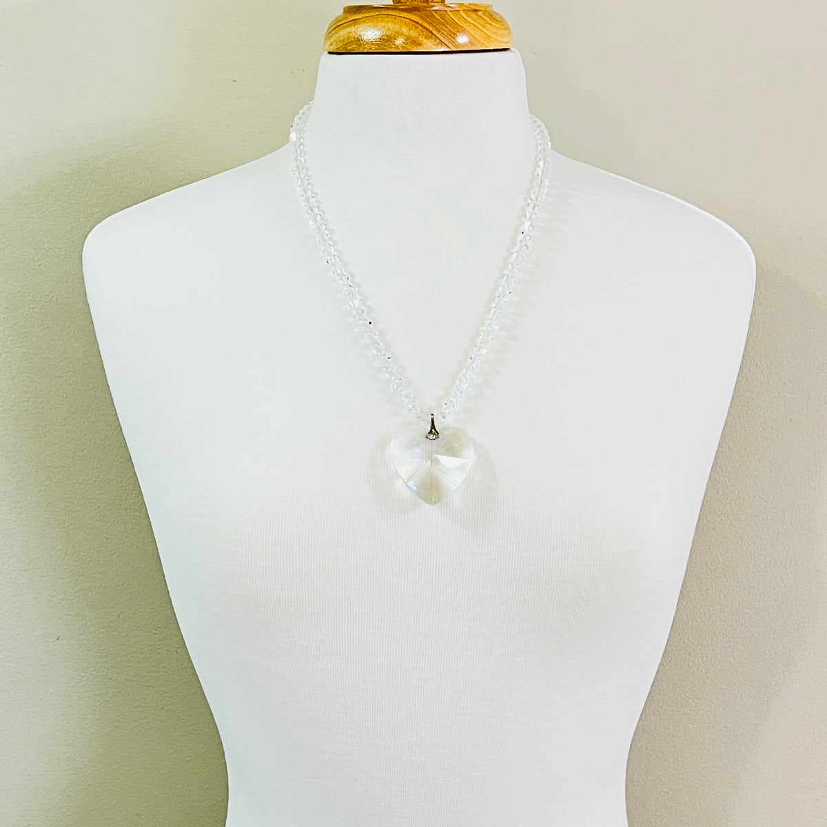 Large faceted crystal heart necklace with clear crystal bicone beads and gold tone box clasp