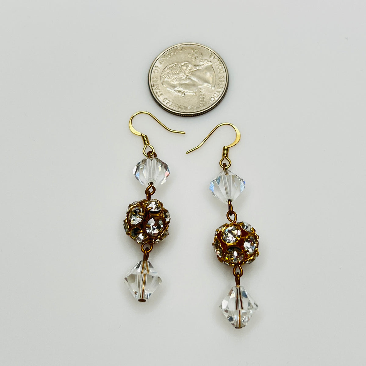 Close-up of clear vintage crystal drop earrings with sparkle detail